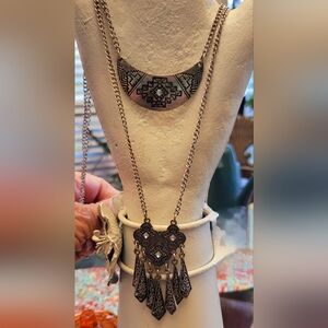 Silver double layered necklace and matching earrings.